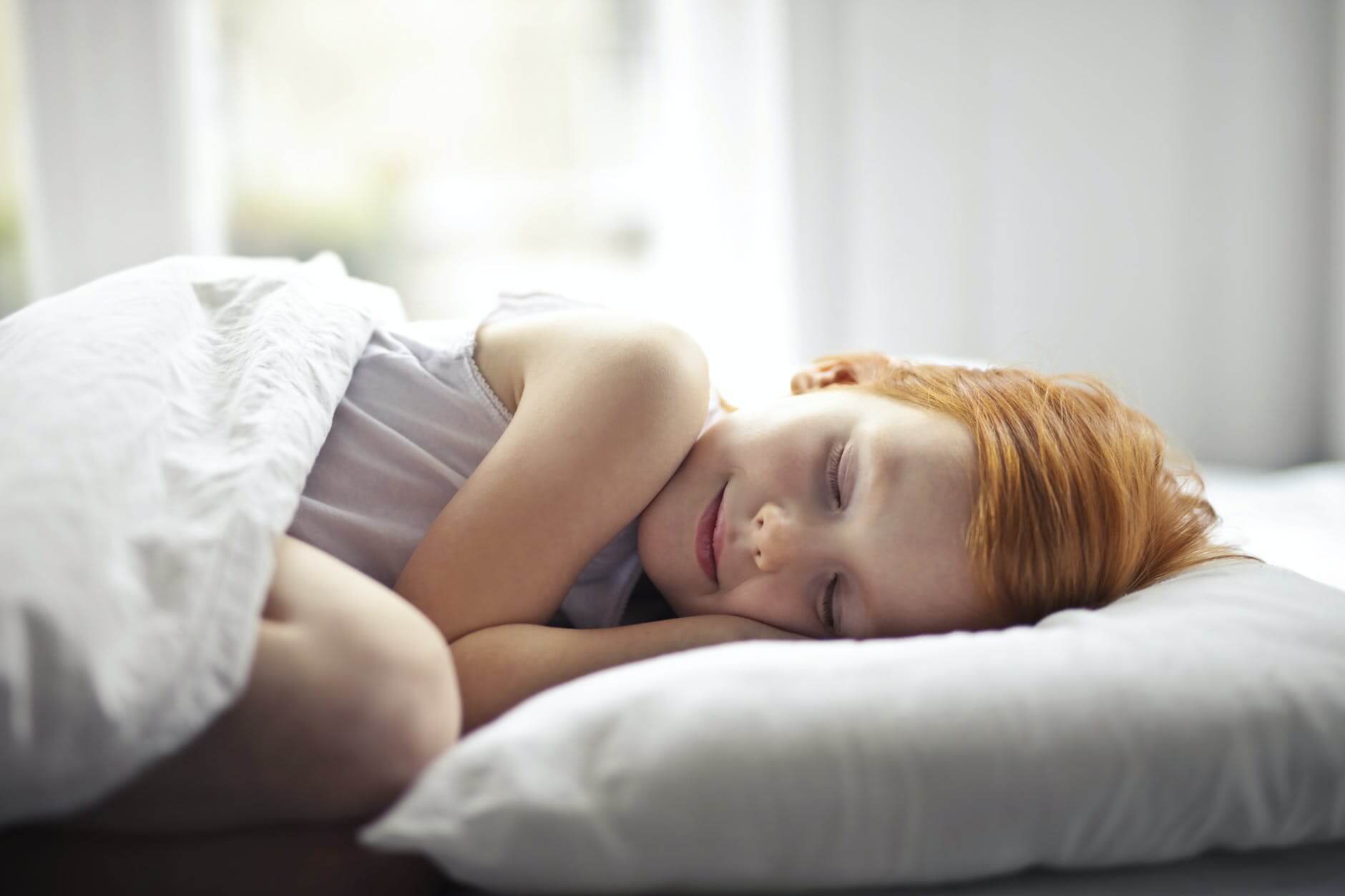 girl lying on bed